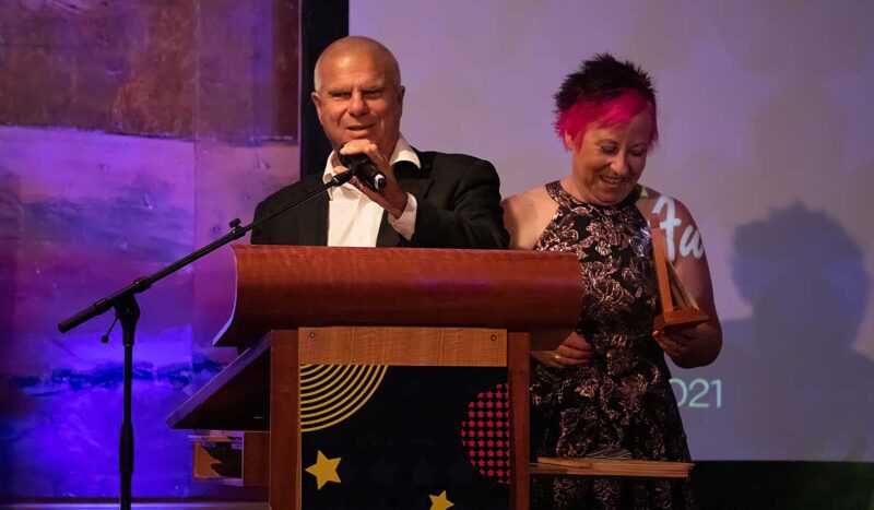 image of greg making a speech at a formal dinner